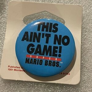 VTG Super Mario Brothers 1993 Movie Promo Button Pin This Ain’t No Game Blue